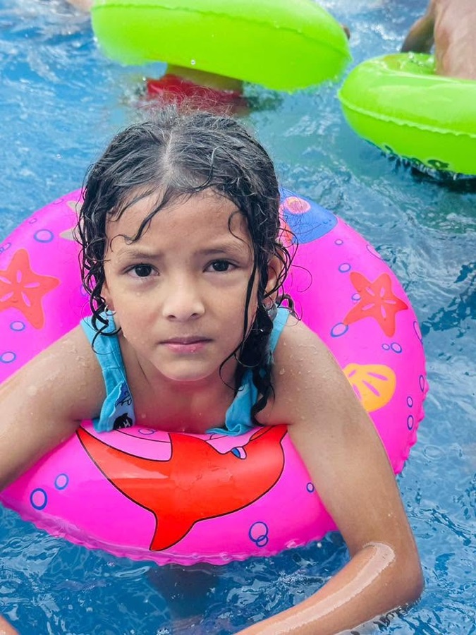 A young learner enjoying the swimming program